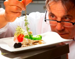 chef using fresh herbs