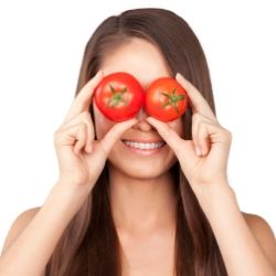 lady retaining hydroponic tomatoes